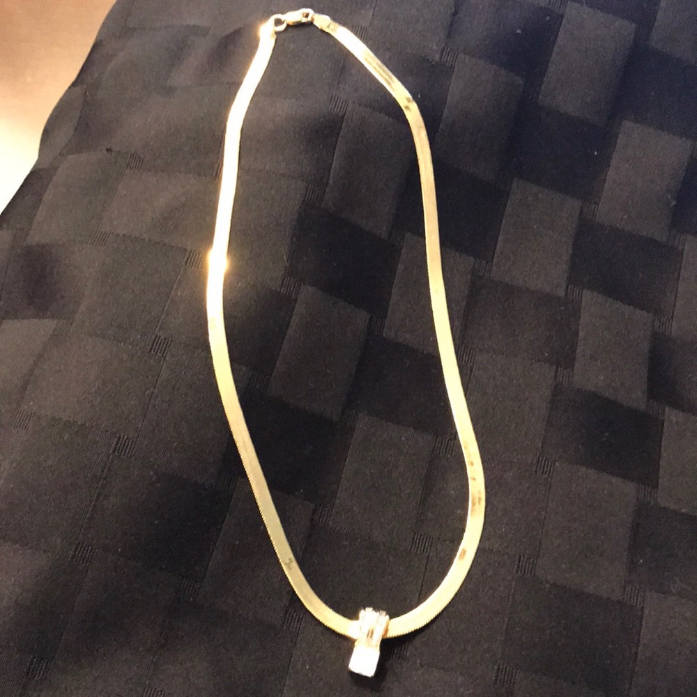 Gold necklace with crystal pendant